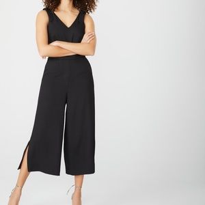 RW&Co. Crop Wide Leg Jumpsuit with Bow detail on shoulder.